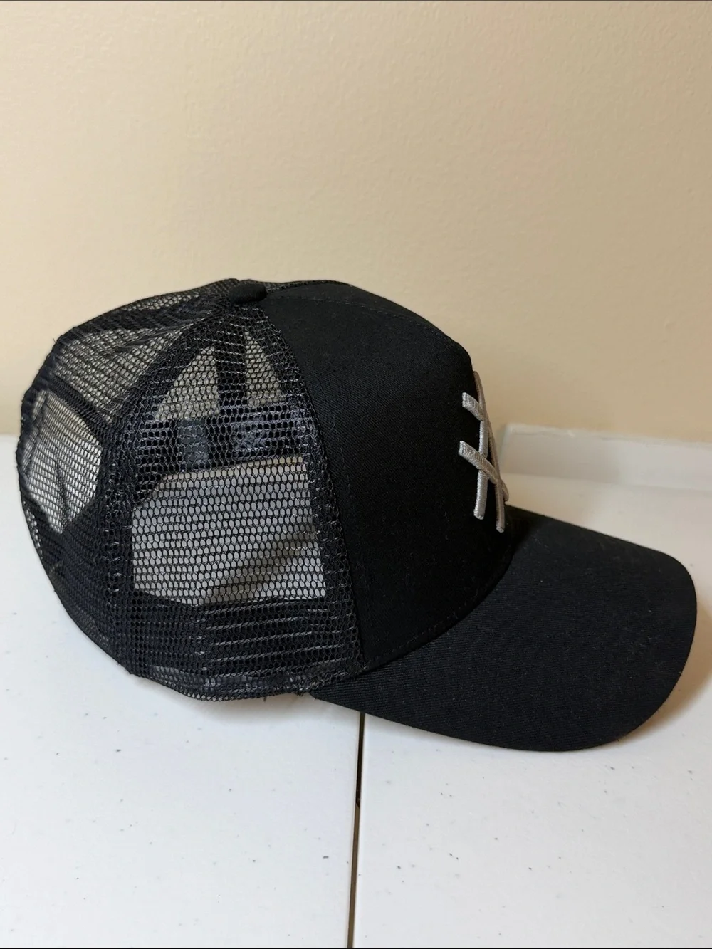 Lucid FC Black Trucker Hat with Silver Embroidered Geometric Logo, Rihanna style